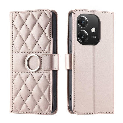 Light pink leather wallet phone case with diamond quilt and ring buckle strap.