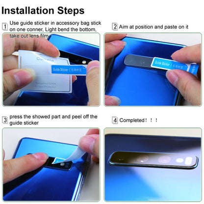 Hands applying rear camera lens glass film protector to phone camera module