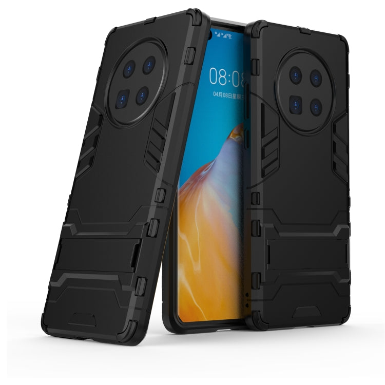 Black shockproof phone case with dual-layer design and raised camera protection