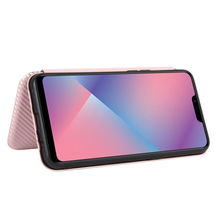 Pink magnetic flip phone case propped up as a stand with phone screen showing