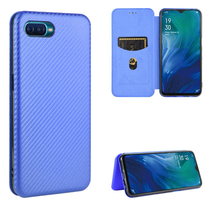 Magnetic flip phone case with card slot, carbon fiber texture, blue color, stand view