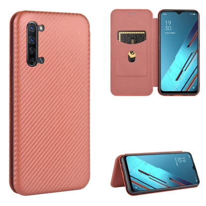 Pink carbon-fiber textured magnetic flip phone case with card slot; phone shown back and stand