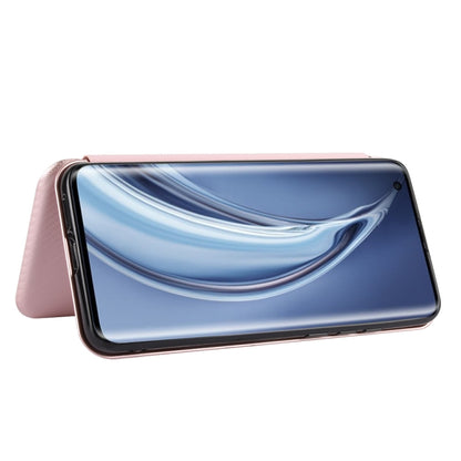 Pink flip phone case folded as a stand, carbon-fiber texture backing