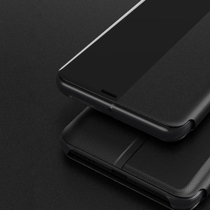Black phone case with flip cover and precise cutouts on the bottom edge