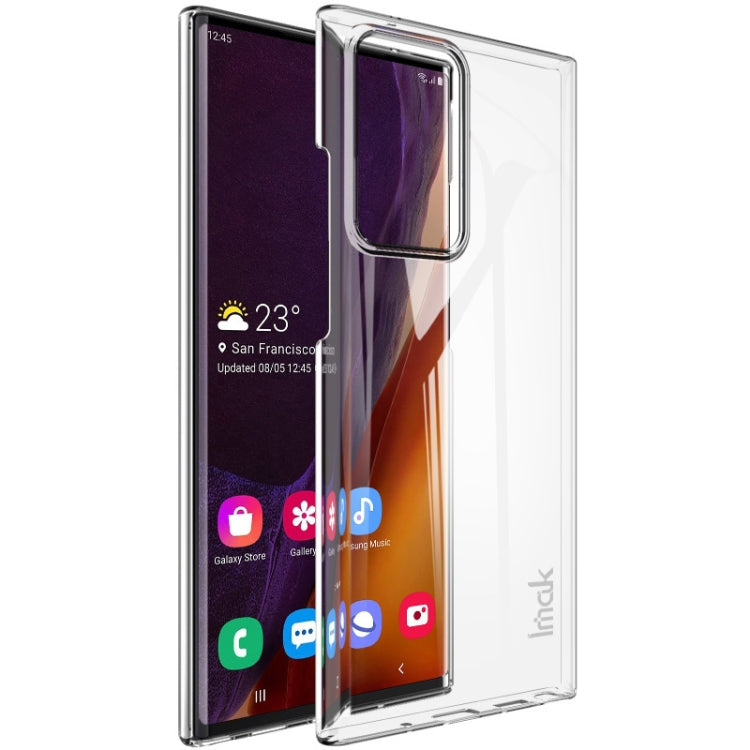 Clear hard phone case with raised edges and camera cutout over smartphone