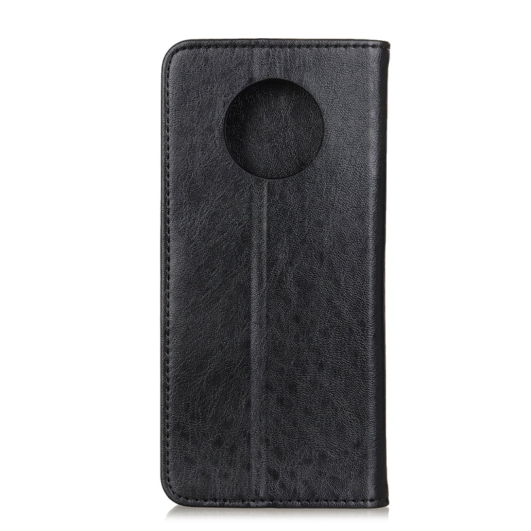 Black leather phone case with round magnetic closure tab on back