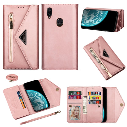 Rose pink leather wallet phone case with zipper, card slots, and lanyard strap.