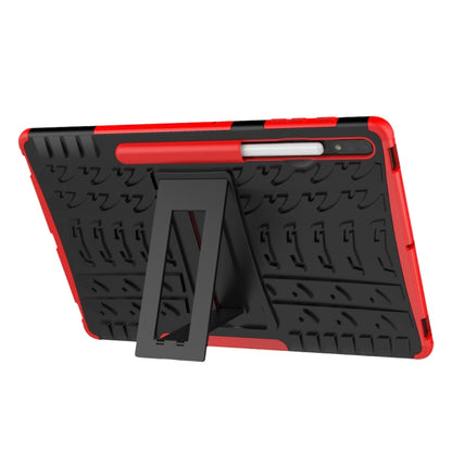 Black tablet case with red trim and angled kickstand support for viewing