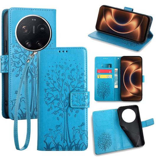 Blue embossed leather phone wallet case with tree and deer design, wrist strap, card holder.
