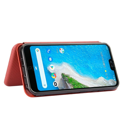 Brown magnetic flip phone case propped as a landscape stand