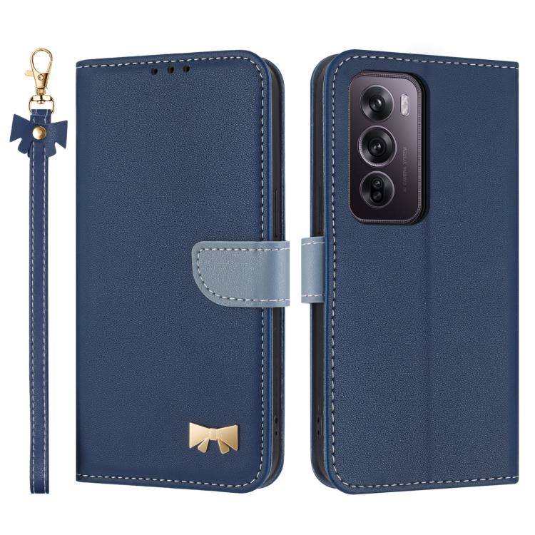 Dark blue leather phone case with hand strap, bow charm, and card-slot flap cover