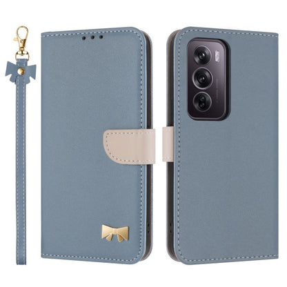 Light blue leather phone case with hand strap, bow charm, and card-slot flap cover