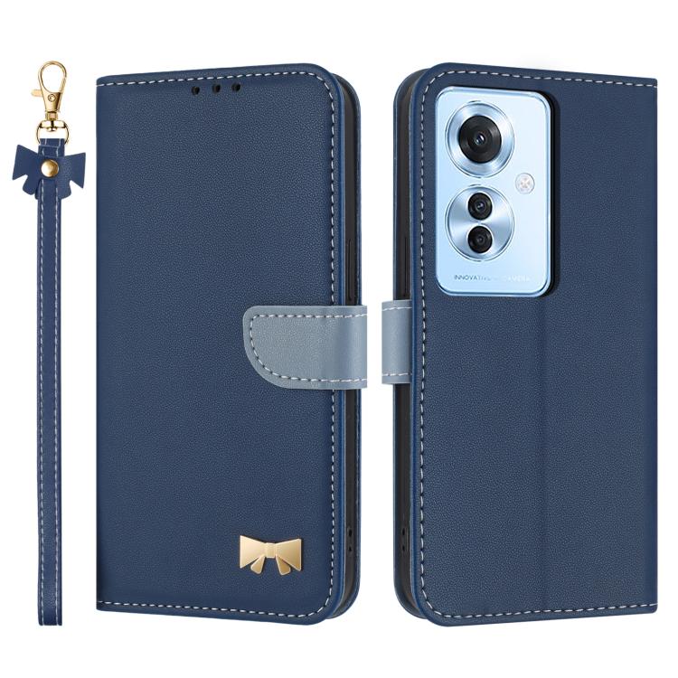 Navy blue leather phone case with wrist strap, flip cover, and gold bow badge