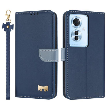 Navy blue leather phone case with wrist strap, flip cover, and gold bow badge
