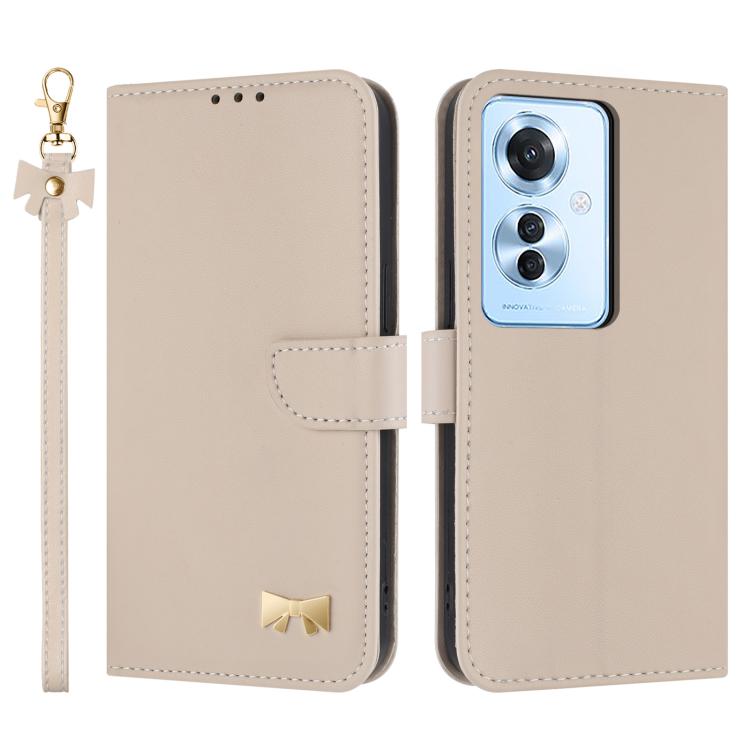 Beige leather phone case with wrist strap and flip cover, showing camera cutout