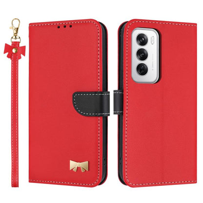 Red leather phone case with hand strap and bow charm, showing camera cutout