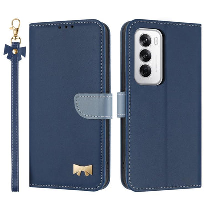 Dark blue leather phone case with hand strap and bow charm, showing camera cutout