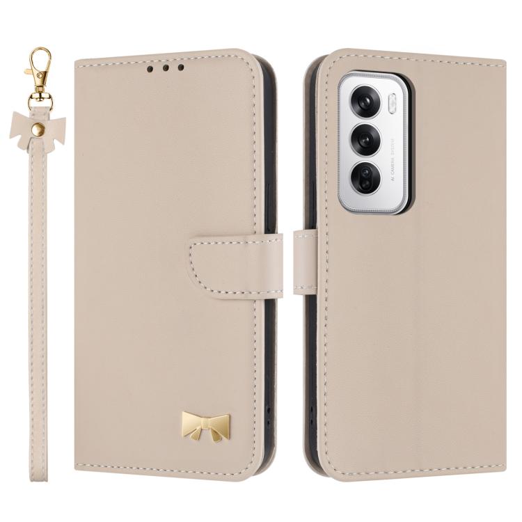 Beige leather phone case with wrist strap, flip cover, and gold bow detail