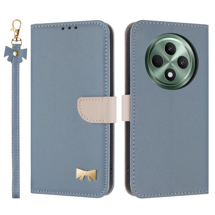 Light blue leather phone case with hand strap, folio flap, metal bow charm, camera cutout.