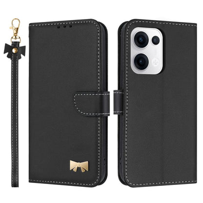 Black leather phone case with hand strap and metal bow charm, front and back view
