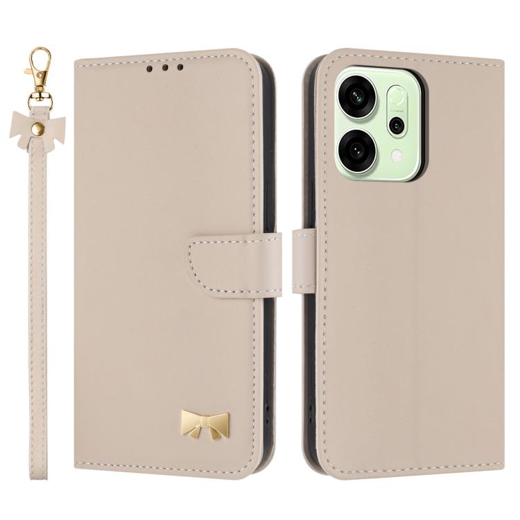 Beige leather-style phone case with wrist strap, folio flap, and gold bow emblem