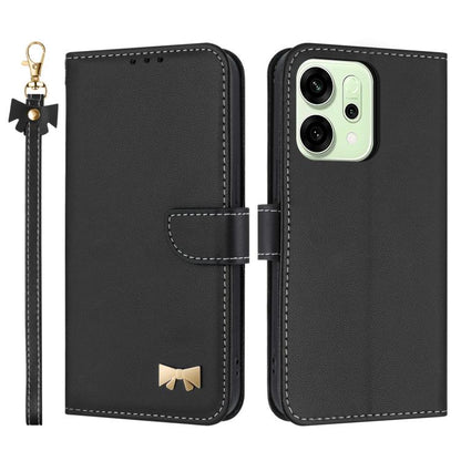 Black leather phone case with wrist strap and bow charm, folio flap and camera cutout