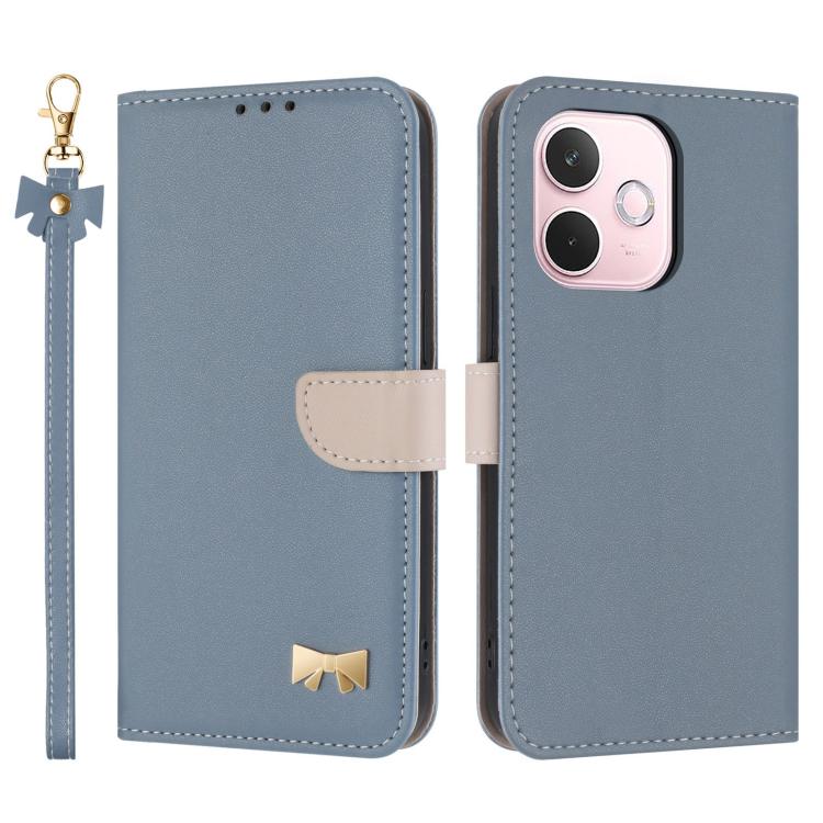 Blue leather-style phone case with wrist strap, folio flap, and gold bow emblem