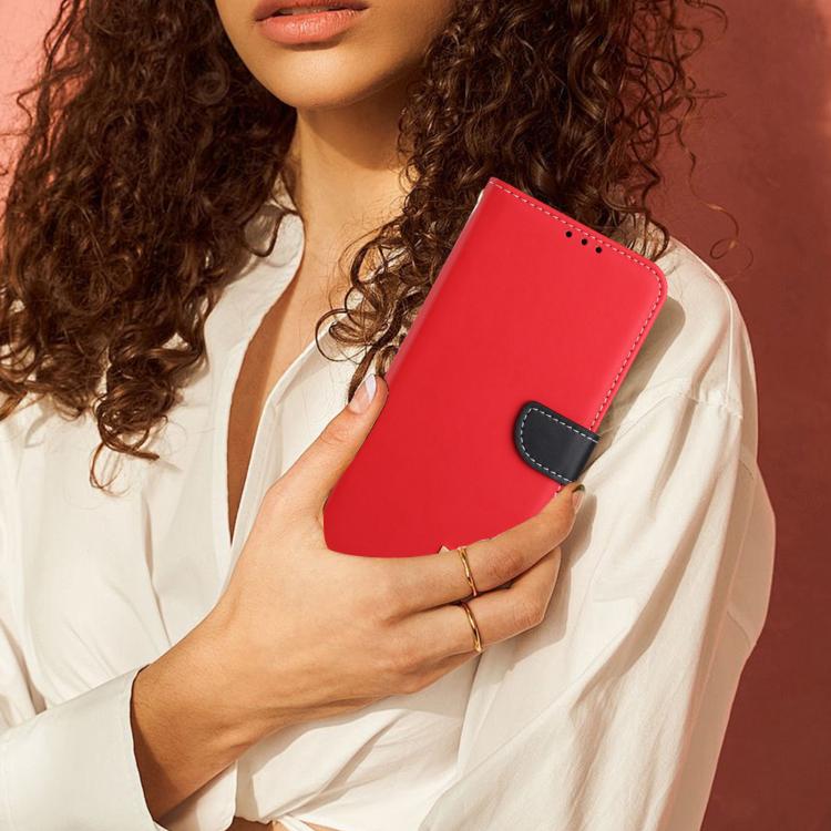 Red leather phone case with metal bow charm and foldover flap