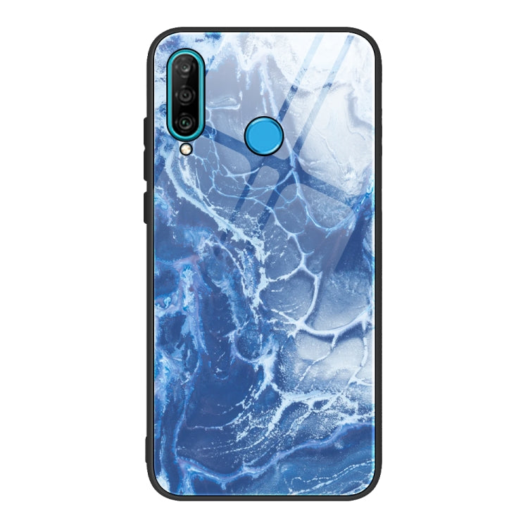 Marble-pattern glass phone case with blue marbled texture; blue camera and power cutouts