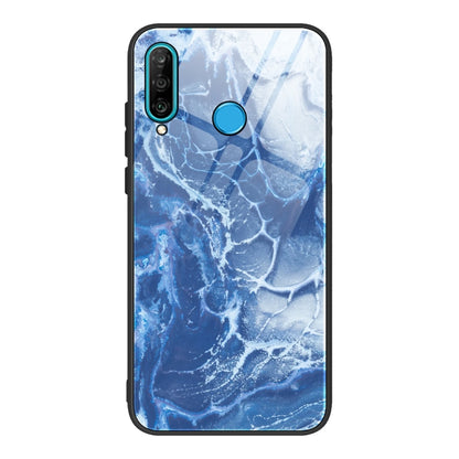 Marble-pattern glass phone case with blue marbled texture; blue camera and power cutouts