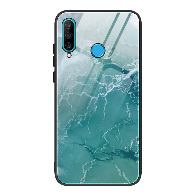 Marble-pattern glass phone case with teal marbled texture; blue camera and power cutouts