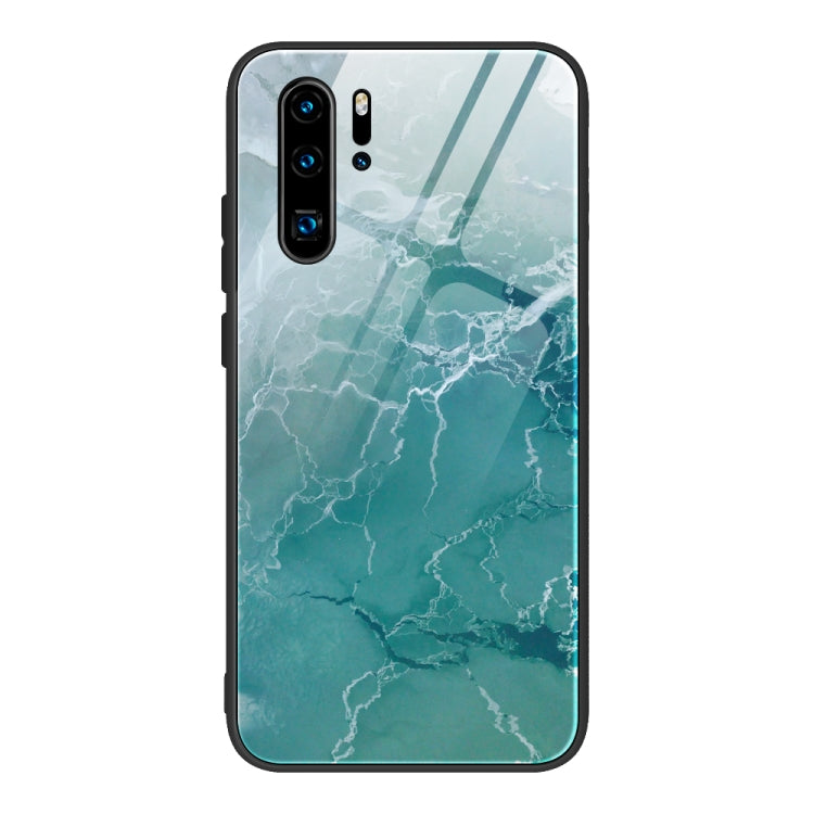 Marble pattern glass phone case with aqua teal cracked lines, black frame, camera cutouts.
