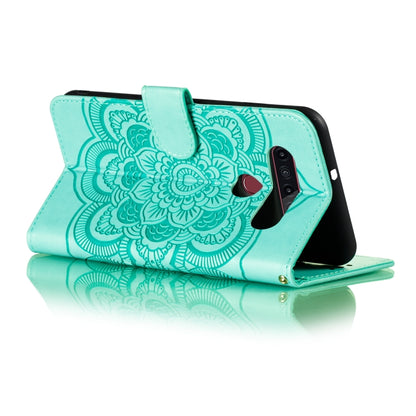 Turquoise mandala embossed flip case with secure closure and camera cutout