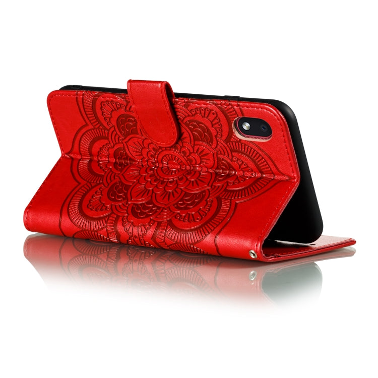 Red PU leather folio phone case with mandala embossing, front cover folded back