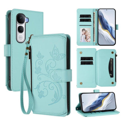Mint green leather wallet phone case with embossed butterfly-flower design, card slots, zipper.