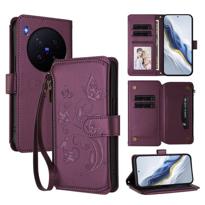 Wine red leather zipper wallet phone case with butterfly floral embossing and wrist strap