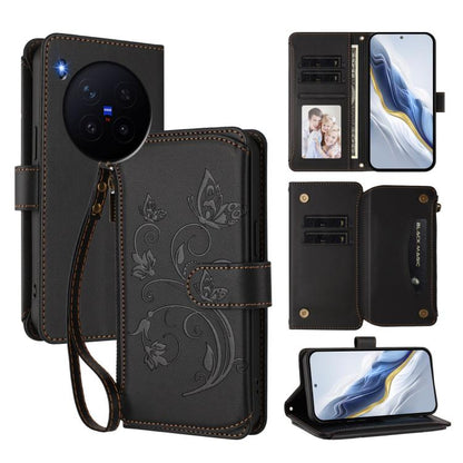 Black leather zipper wallet phone case with butterfly floral embossing and wrist strap