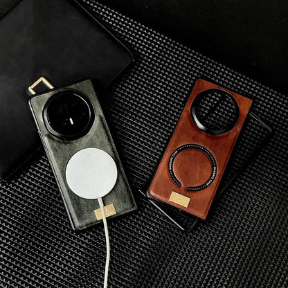 Two MagSafe magnetic phone cases: dark gray with ring pad and brown/orange with ring pad