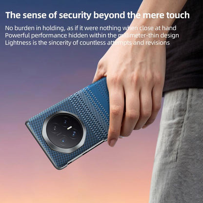 Blue woven magnetic phone case with camera cutout, held in hand