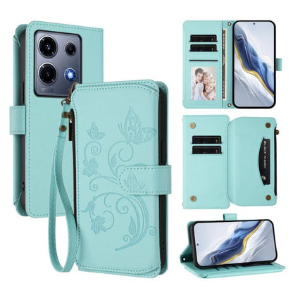 Mint green leather phone wallet case with butterfly floral embossing, zipper and wrist strap
