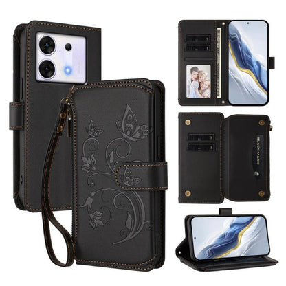 Black leather phone wallet case with wrist strap, floral emboss, multi-card slots and zip pocket.