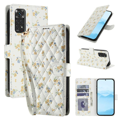 White floral leather phone case with buckle strap and quilted diamond pattern, with lanyard