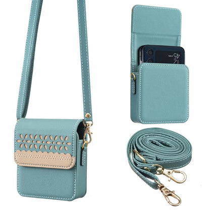 Light teal leather crossbody flip phone bag with cutout floral front and detachable strap