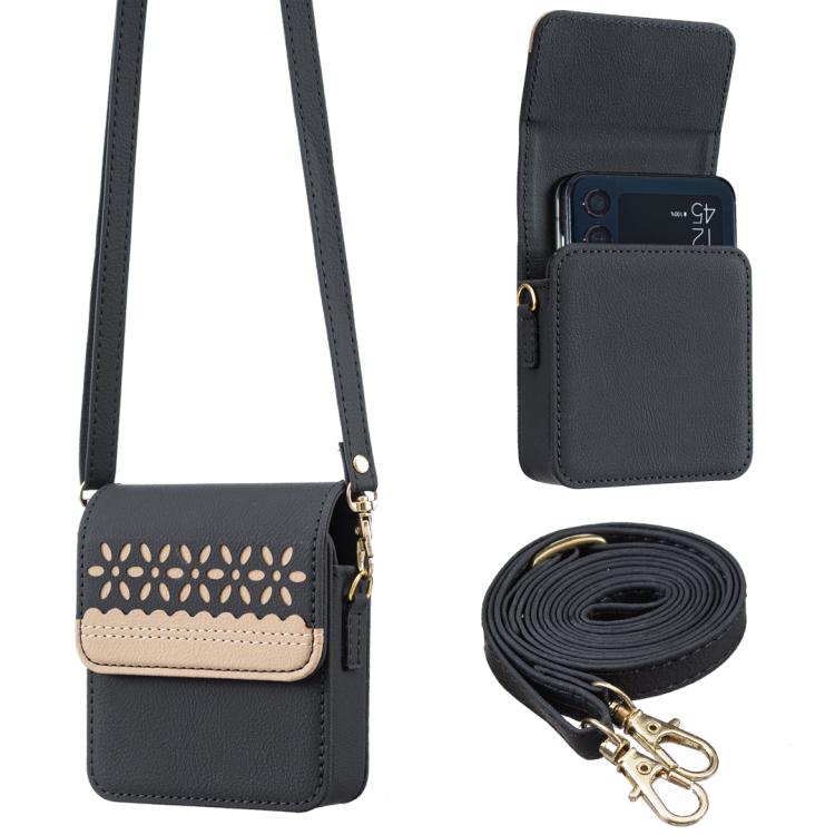 Black leather crossbody flip phone bag with cutout floral front and adjustable shoulder strap