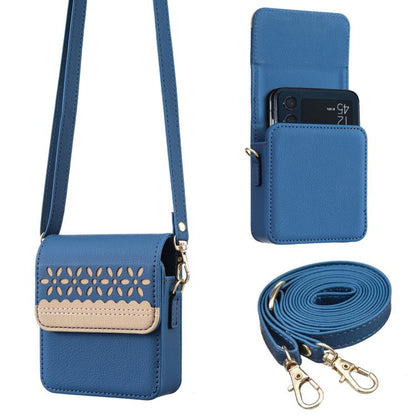 Blue leather crossbody flip phone bag with cutout lace flap and adjustable strap