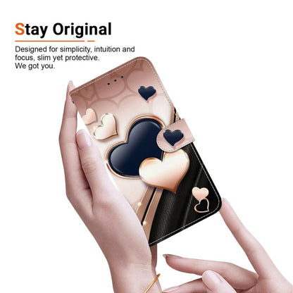 Heart-themed phone case with folio cover and wrist strap, shown in a hand.