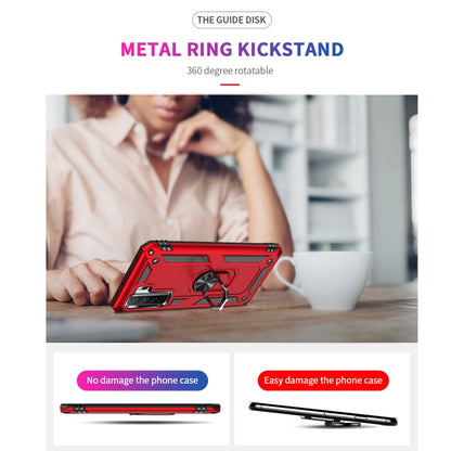 Red rugged phone case with ring kickstand propping the phone on a table.