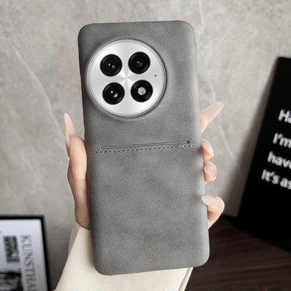 Grey sheepskin card slot phone case with circular camera cutouts and stitched band