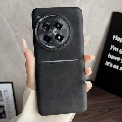 Black sheepskin card slot phone case with camera cutout and stitched strap detail