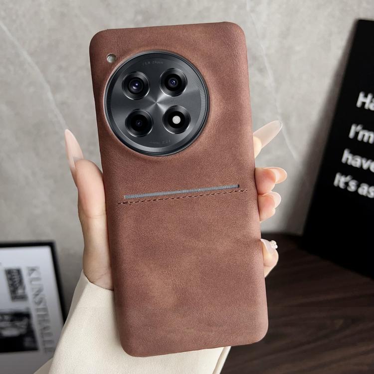 Brown sheepskin card slot phone case with camera cutout and stitched strap detail